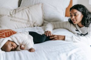 Mother watching if baby is breathing at night due to postpartum anxiety