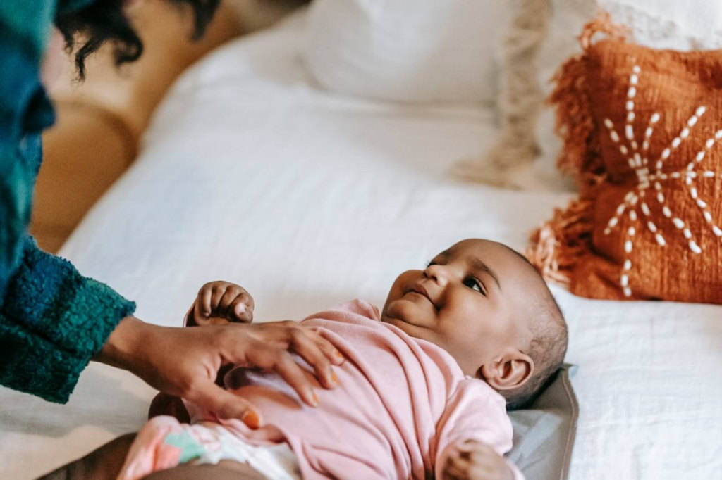 New mother experiencing the maternal safety loop that is fueling postpartum hypervigilance constant  checking, and anxiety. 